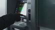 © CreativeIMGIdeas - Gloved hand operating an ATM, highlighting themes of financial fraud, cyber security risks, or anonymous banking transactions.