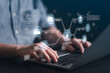© kasinv - Close up of man typing on laptop keyboard with virtual data protection shield and encryption icons. Concept of cybersecurity software, secure cloud storage, and privacy coding.