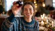 © Kateryna - Happy faceless woman in festive sweater raising wine glass in cheerful toast during intimate dinner party with close friends looking toward camera celebration gathering around