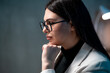 © Лиза Птицына - Concentrated businesswoman in professional attire at office desk. Business concept.