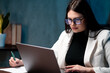 © Лиза Птицына - Business analyst woman examining performance growth charts indoors. Business intelligence concept