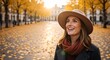 © Vasiliy - Happy smiling woman in a hat enjoying an autumn day in a city park. Stylish young person walking on a street with yellow leaves. Fall fashion and lifestyle concept