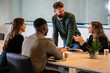 © Zoran Jesic - Diverse business team collaborating during a corporate meeting