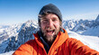 © Zahar Berduta - Young man smiling while taking selfie at mountain peak in winter