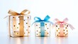© Stormlab99 - Three beautifully wrapped empty gift boxes with colorful polka dot patterns and decorative ribbons in gold blue and pink