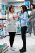 © DC Studio - Asian pharmacist offers clear medical advice to middle aged woman, discussing treatment options, prescription medicine, and wellness support through professional and informative consultation.