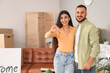 © Pixel-Shot - Young couple with key to rented apartment on moving day
