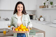 © Pixel-Shot - Young woman with ripe oranges in kitchen