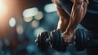 © ttonaorh - Close-up of strong athletic man performing dumbbell curls in gym