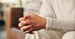 © OnPoint/peopleimages.com - Person, hands and waiting with hope for anxiety, nevous behaviour or anticipation in home. Closeup, fingers and stress with self control or loss for patience, grief or mental health on sofa in house