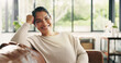 © OnPoint/peopleimages.com - Portrait, relax or happy woman on sofa with smile in living room in home, house or apartment. Face, comfortable lady or female person on couch with peace or confidence resting on break for wellness