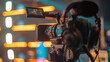 © Aliaksei - Professional Video Camera on Tripod Filming Event with Bright Bokeh Lights and Copy Space