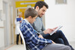 © auremar - a boy and dad at the waiting room