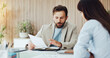 © DavidsPrime/peopleimages.com - Business, people and meeting with document in office for planning, finance report and contract. Team, talking and paperwork for company budget, financial expenses and information for funding proposal