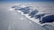© HadilCreative - Aerial View of Antarctic Ice Shelf with Glacial Features and Open Water Under Clear Blue Sky on Sunny Day