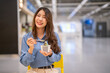 © Art_Photo - Young asian woman eating ice cream cup with wooden spoon in shopping mall, Happy female customer enjoying sweet dessert treat during shopping break, Lifestyle, food court and eco friendly concept