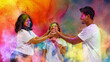 © master1305 - Three friends playfully smearing colors on each other at Holi festival. Concept of cultural moment, dynamic powder explosion background and vibrant spring celebration content for branding and promo.