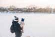 © phpetrunina14 - Father and child enjoying winter outdoors Copy Space