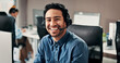 © P2000/peopleimages.com - Portrait, man and happy with headset in call center for customer service, assistance and help desk. Smile, male advisor and coworking with computer, contact us and representative of technical support