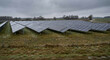 © PatrykRoams - Renewable energy solar panels farm 4K