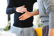 © Studio Marmellata - Two men shake hands, signifying a successful business deal or a friendly greeting. Their open palms and clasped hands convey trust and partnership.