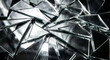© Oleksii - Broken mirror shards with reflective surfaces in an angular glass collage under studio lighting