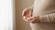© Janna - Taking Prenatal Vitamin during dietary supplements intake at home