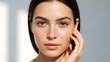 © Zobia - High-end beauty headshot of a beautiful brunette woman with flawless glowing skin and warm brown eyes, posing with hand near face in soft daylight, ideal for luxury dermatology, organic skincare