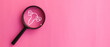 © chinnarach - close up top view on magnify with uterus symbol on pink background represent about women health checkup and lifestyle for health and wellness concept