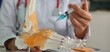 © Nadzeya - Doctor orthopedist makes an injection with blockade medication for cartilage regeneration and metabolism, closeup