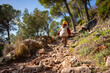 © sutulastock - Small boy hiking alone uphill on rocky forest trail, child exploration, independence, outdoor adventure, childhood freedom, nature discovery, active lifestyle, mountain path