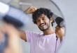 © Prostock-studio - A man stands in front of a mirror drying his hair with a hair dryer. He smiles while fixing his hair. The scene shows a bright room with a casual and relaxed atmosphere.