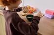 © Bliss - Joyful moments in the kitchen as a little boy prepares his breakfast with cereal
