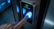 © Proma - Person scanning their fingerprint on a biometric device for secure access.