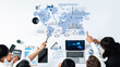 © InfiniteFlow - A business team collaborates to analyze global data and statistics displayed on a world map. Utilizing technology, they strategize for future growth and insights. Trope