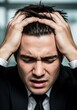 © Laillavivo - Professional person displays intense distress and frustration while grasping his hair.
