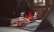© Looker_Studio - Businessman with financial warning icons and alert symbols, cybersecurity risk and fraud detection concept, online banking security, data breach prevention, financial compliance monitoring.