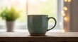 © monirs33 - Cozy morning coffee mug by the window with soft bokeh lights