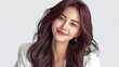 © NovaVision - Beautiful young Asian woman with long, wavy, dark red hair smiling gently