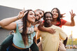 © Vane Nunes - Young diverse friends have fun hugging together in the city - Friendship and diversity concept