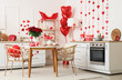 © Pixel-Shot - Stylish interior of light kitchen decorated for Valentine's Day with beautiful roses, gifts and tea set on table
