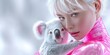 © NovaVision - Young woman with striking blue eyes gently holds a fluffy koala bear in a close-up portrait