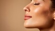 © NovaVision - Close-up profile of a woman's face with closed eyes and glowing skin