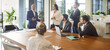 © Studio Romantic - Business leader speaking on office meeting in front of diverse team of corporate employees. Idea and task presentation from senior boss at briefing, people listen important speech together