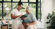 © OnPoint/peopleimages.com - Tablet, physiotherapist and old woman in consultation, laugh and medical results in clinic. Tech, physical therapy or senior patient with chiropractor for healthcare recovery, rehabilitation or funny