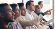 © Kobus Louw/peopleimages.com - Man, audience and point at conference with business people with attention, insight or feedback. Person, crowd and gesture for review, workshop or group with notes at corporate training convention