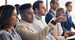 © Kobus Louw/peopleimages.com - Man, audience and point with discussion at conference with business people, insight or feedback. Person, crowd and gesture for review, workshop or attention with team at corporate training convention