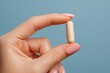 © Anna - Health supplement capsule in female hand