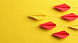 © Qaqas - red planes are flying the old way yellow paper planes are flying the new way. changing path idea. Different thinking, Business leader, personality development idea concept.
