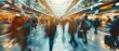 © petrrgoskov - Wide angle view of commuters moving through a modern train station with motion blur, showing urban transport flow, daily travel routine and fast paced city life.